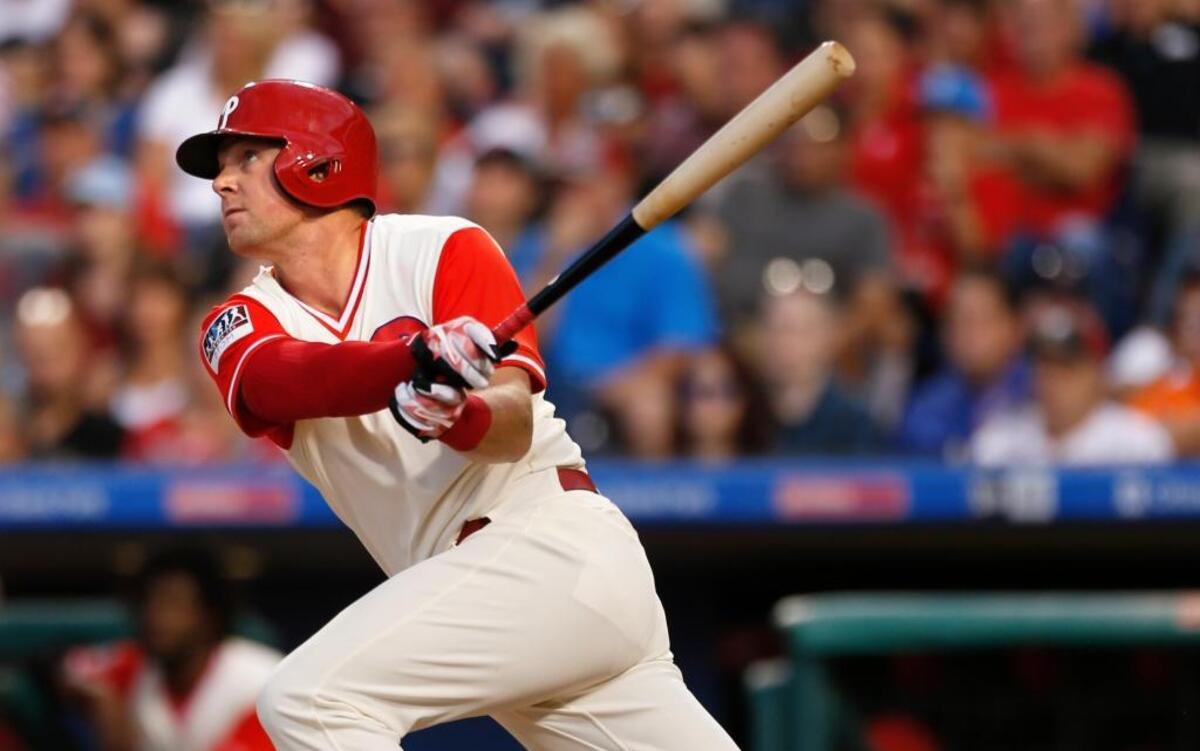 Philadelphia Phillies' Rhys Hoskins follows through on a two-run home run in the first inning of a baseball game against the Philadelphia Phillies, Saturday, Aug. 26, 2017, in Philadelphia. Freddy Galvis scored.