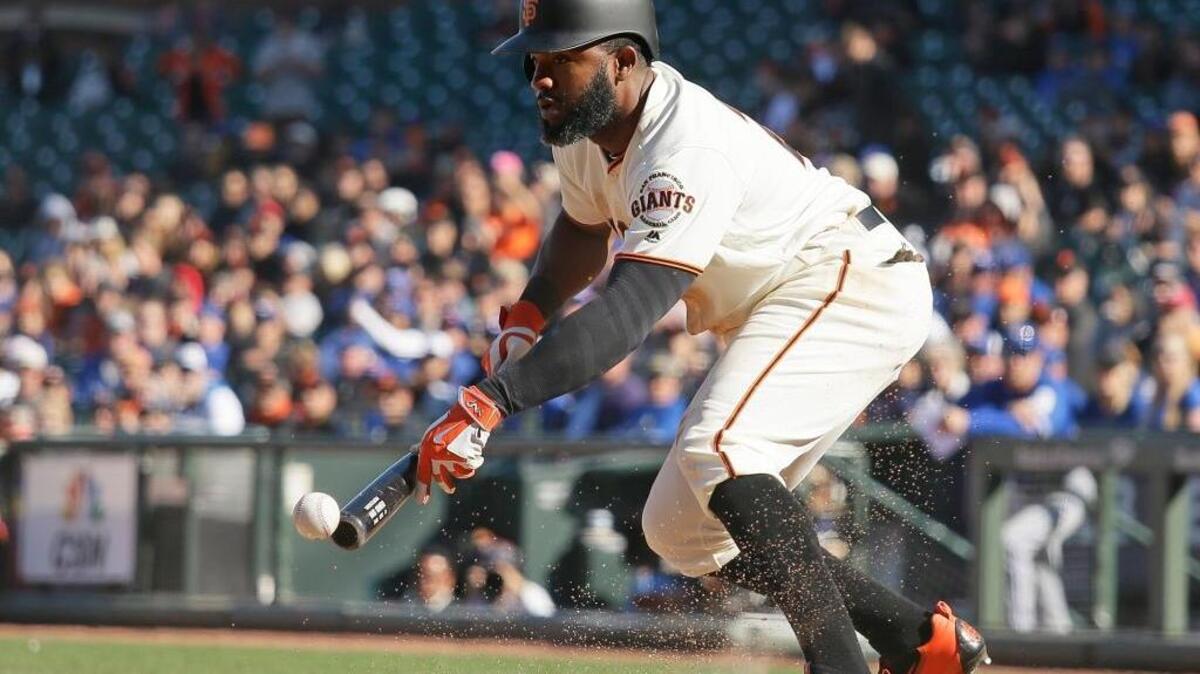San Francisco Giants outfielder Denard Span bunts the ball in the 13th inning of their baseball game against the Toronto Blue Jays Wednesday, May 11, 2016, in San Francisco. San Francisco won the game 5-4. Span and fellow outfielder Hunter Pence both enjoyed a big week.
