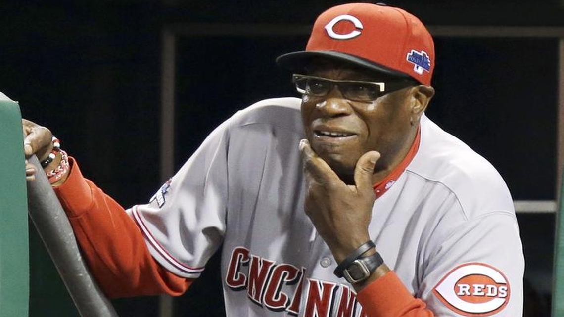 
Cincinnati Reds manager Dusty Baker watches from the dugout steps as the Pittsburgh Pirates bat in the fifth inning of the N.L. wild-card playoff baseball in Pittsburgh in 2013. 
