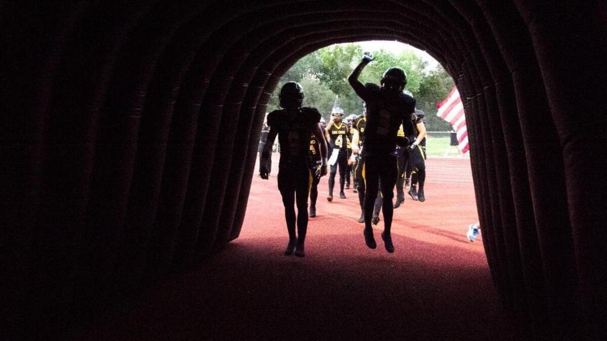 
Del Oro players take the field for a nonleague football game against Bellarmine of San Jose earlier this season.
