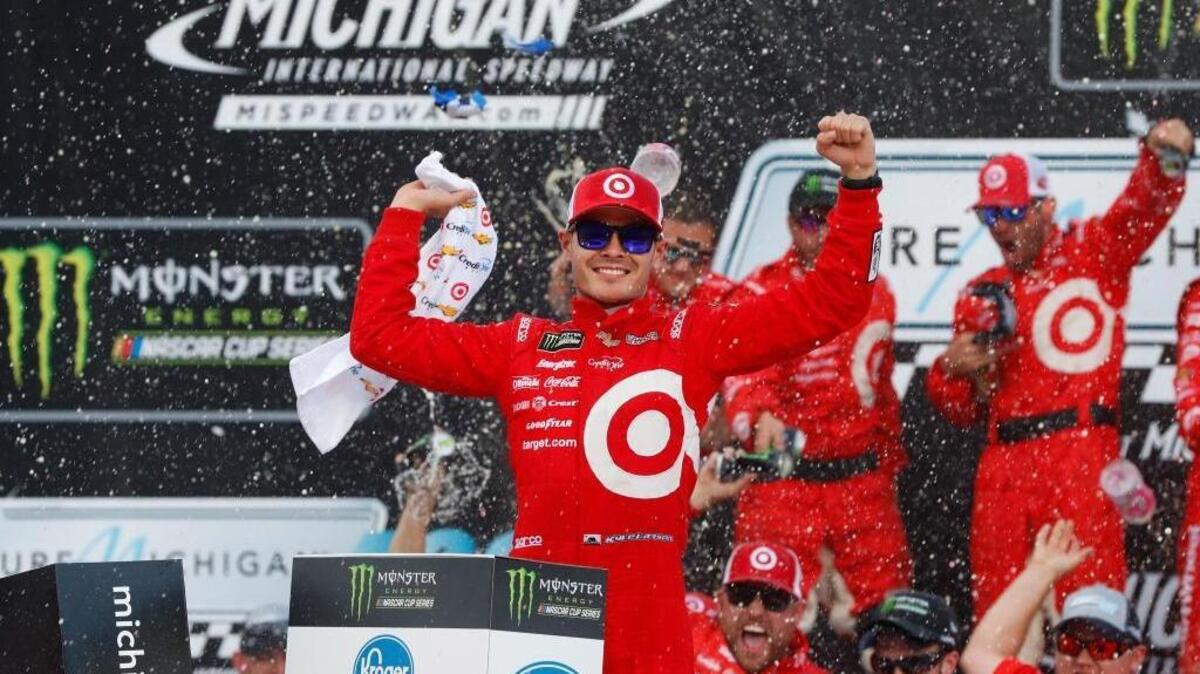 Kyle Larson celebrates winning the Monster Energy NASCAR Cup Series race Sunday in Brooklyn, Mich. It’s his third consecutive victory at the speedway.