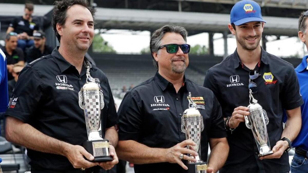 Indianapolis 500 winner Alexander Rossi, right, poses Saturday with car owners Michael Andretti, center, and Bryan Herta after they received their “Baby” Borg-Warner Trophies for winning last year’s race. Rossi finished seventh in Sunday’s race.