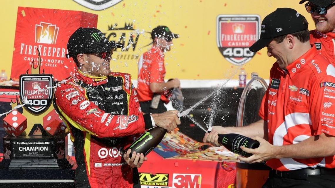 Kyle Larson, left, celebrates after winning the Monster Energy NASCAR Cup Series race Sunday in Brooklyn, Mich. It’s the second win this season for the Elk Grove native.