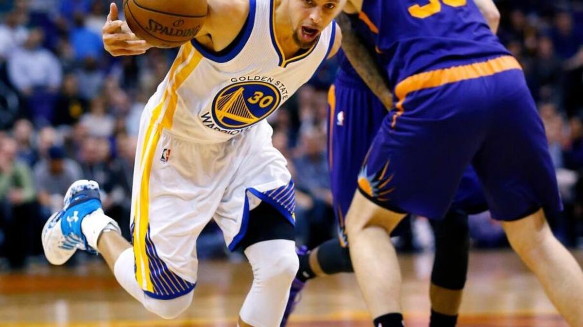 Warriors guard Stephen Curry (30) is fouled by the Phoenix Suns’ Mirza Teletovic on Wednesday, Feb. 10, 2016, in Phoenix.