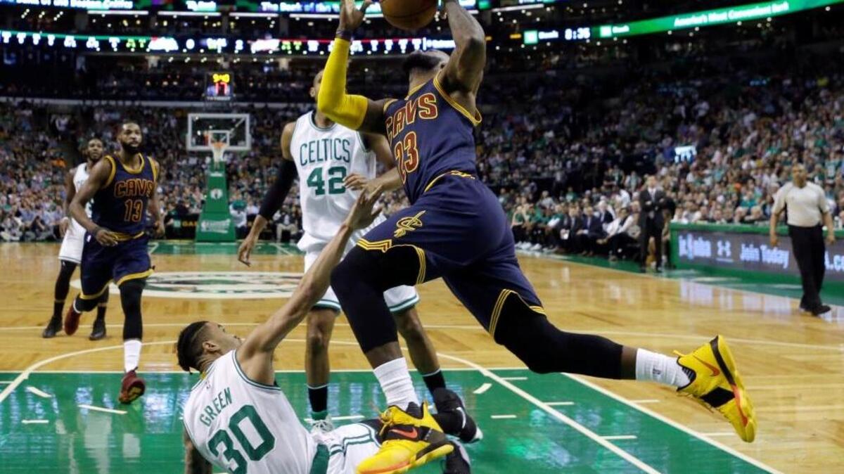 Cleveland Cavaliers forward LeBron James (23) drives to the basket over Boston Celtics forward Gerald Green (30) during the first half of Game 2 of the Eastern Conference finals on Friday in Boston.