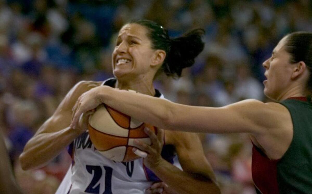 FILE -- Sacramento Monarchs point guard Ticha Penicheiro is fouled by Seattle Storm’s Sue Bird as she drives to the basket in the second half of the WNBA game, Saturday, June 17, 2006, at Arco Arena.
