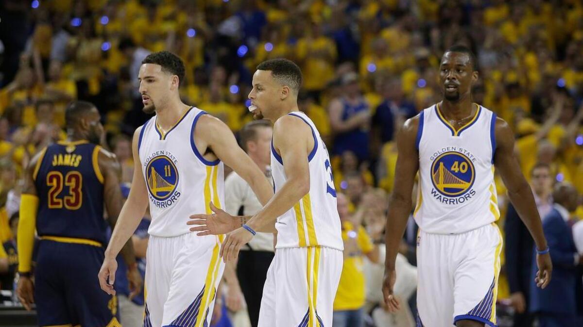 Warriors guards Klay Thompson, left, and Stephen Curry hope a quiet Game 1 was just an aberration.