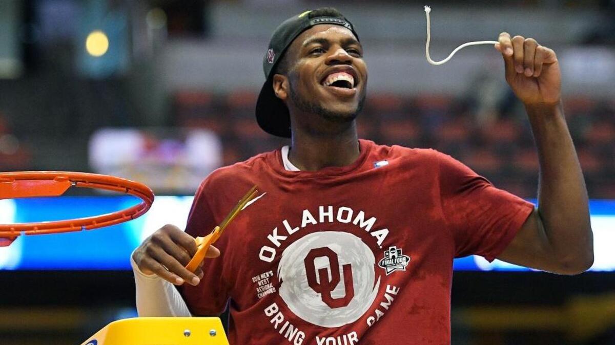 Oklahoma guard Buddy Hield cuts down the net after the Sooners’ 80-68 their win against Oregon during an NCAA college basketball game in a regional final of the NCAA Tournament, Saturday, March 26, 2016, in Anaheim. Hield led all scorers with 37 points.