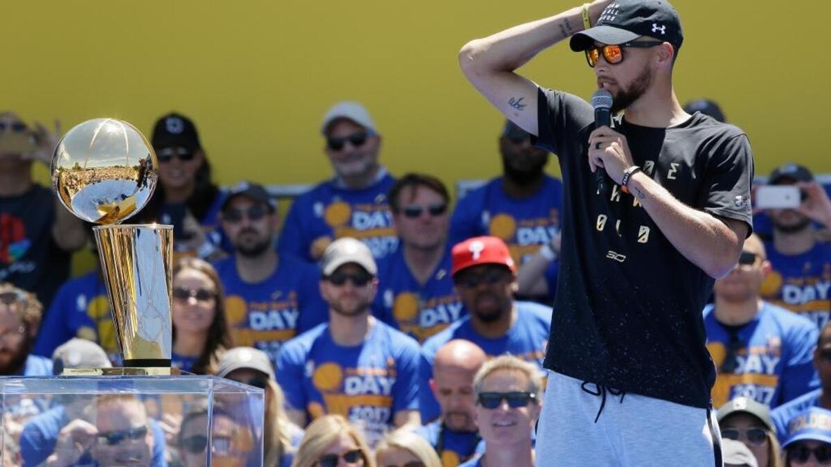 Stephen Curry speaks at a rally for the Golden State Warriors winning the NBA championship Thursday, June 15, 2017, in Oakland, Calif. Oakland is celebrating its second championship in the past three years.