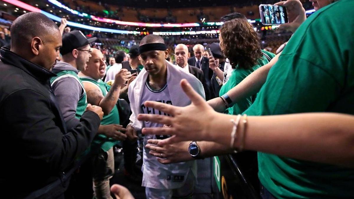 Boston Celtics guard Isaiah Thomas, center, is congratulated by fans after a win against the Washington Wizards on Tuesday in Boston. Thomas scored 53 as the Celtics took a 2-0 lead in the series.