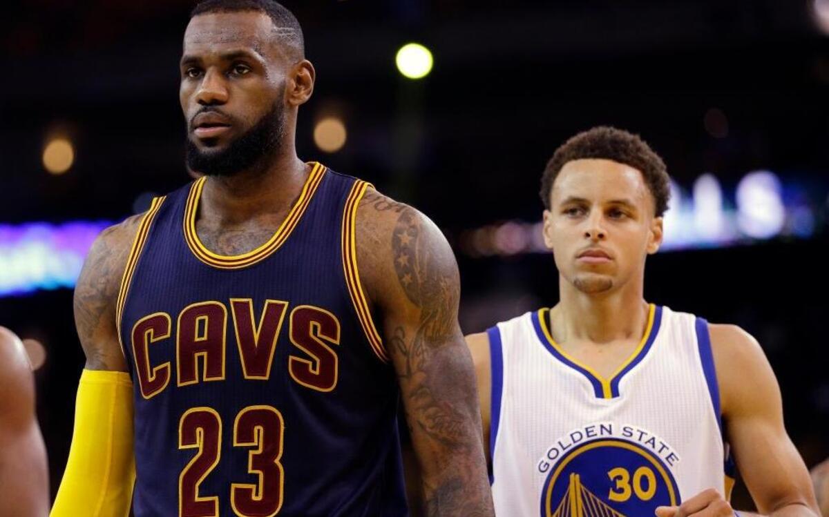 Cleveland Cavaliers forward LeBron James (23) and Golden State Warriors guard Stephen Curry last met on the court during last season’s NBA Finals. They’ll meet again on Christmas day in a nationally televised game. ... James and Curry look on during Game 5 of basketball’s NBA Finals in Oakland on Sunday, June 14, 2015.