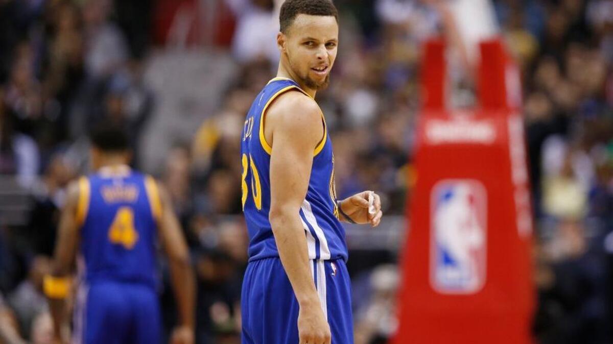 Warriors guard Stephen Curry (30) reacts in the second half against the Washington Wizards on Feb. 3, 2016, in Washington. The Warriors won 134-121.