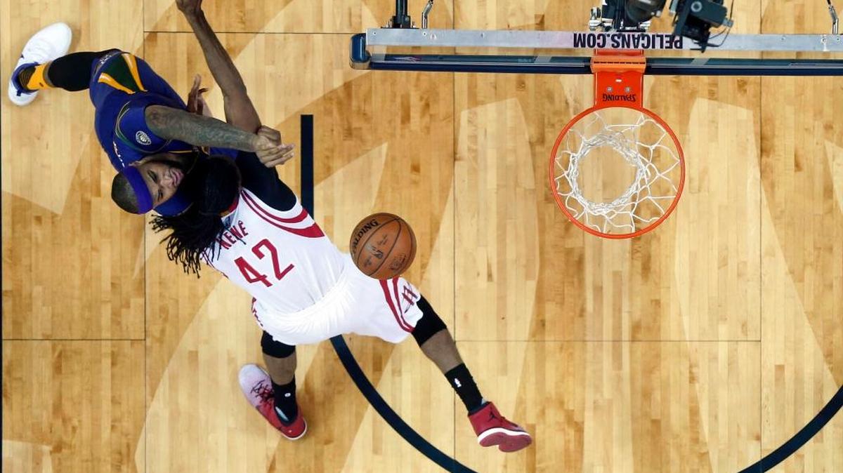 Pelicans forward DeMarcus Cousins, left, shoots against Houston Rockets center Nene Hilario in New Orleans on Thursday, Feb. 23, 2017.