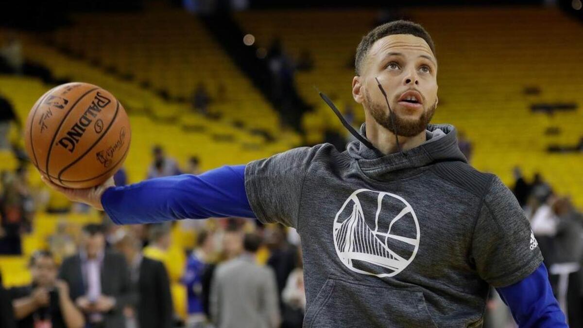 Golden State Warriors guard Stephen Curry warms up before Game 5 of the 2017 NBA Finals on June 12. Curry will offer an online course to help people improve their basketball skills.