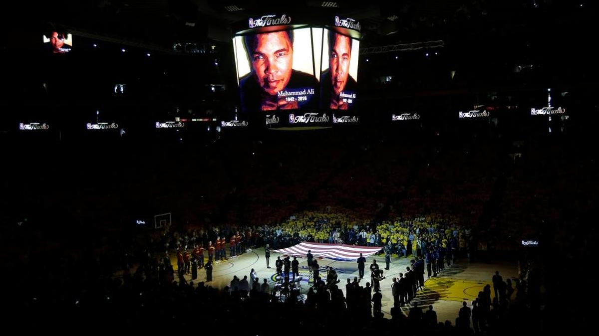 A tribute to boxer Muhammad Ali is shown on the video board before Game 2 of basketball’s NBA Finals between the Golden State Warriors and the Cleveland Cavaliers in Oakland, Calif., on Sunday, June 5, 2016. Ali died Friday in Phoenix. He was 74.