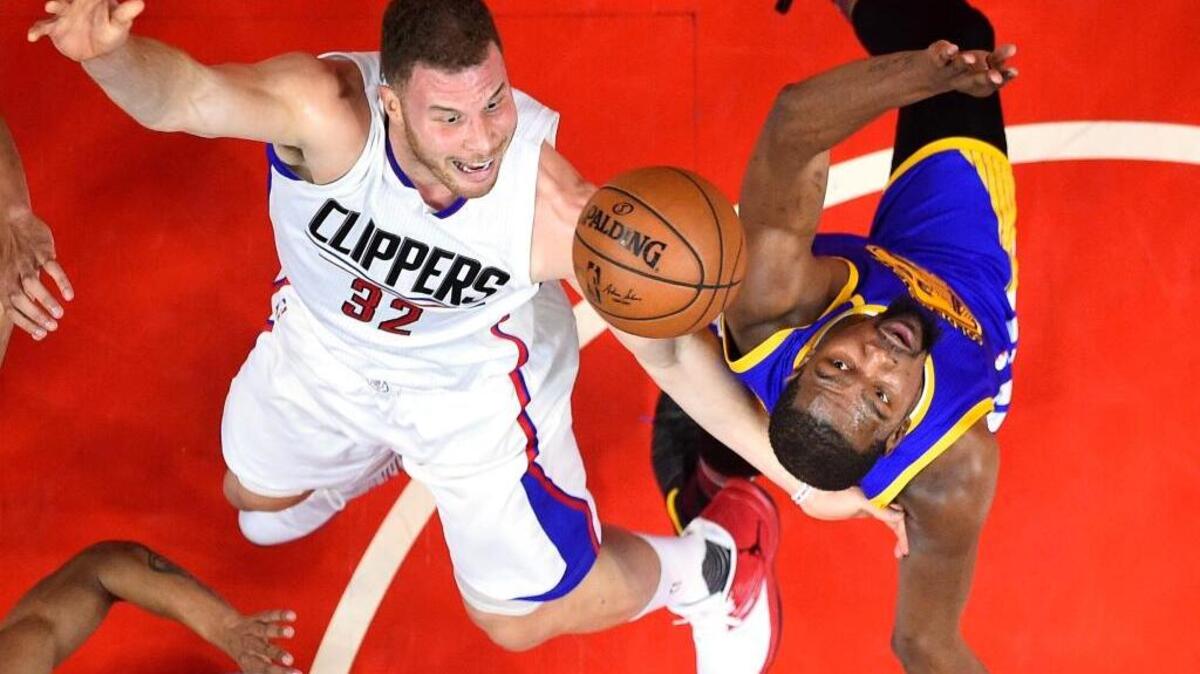 Los Angeles Clippers forward Blake Griffin, left, shoots as Warriors forward Kevin Durant defends during the first half on Thursday night in Los Angeles.