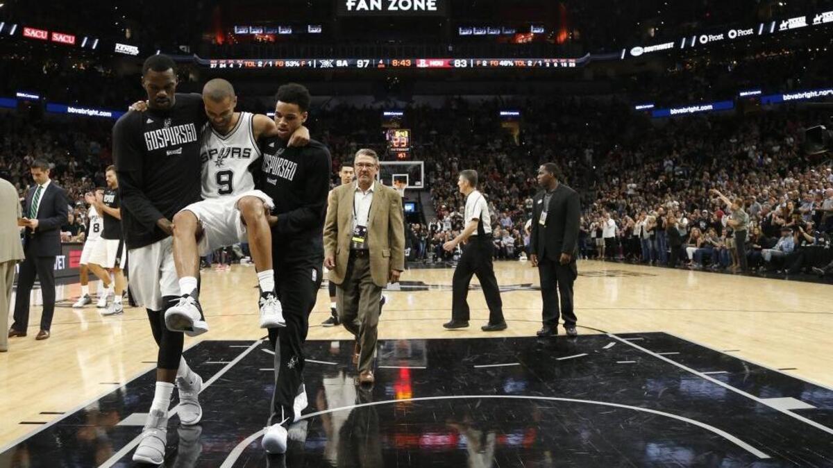 San Antonio Spurs guard Tony Parker is carried off the court after being injured during the second half of Game 2 of a second-round NBA basketball playoff series against the Houston Rockets, Wednesday, May 3, 2017, in San Antonio. Parker underwent quadriceps surgery on Friday and will miss the rest of the playoffs.