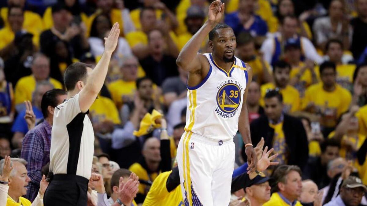 Golden State Warriors’ Kevin Durant (35) celebrates after scoring against the San Antonio Spurs during the second half of Game 2 of the Western Conference finals on Tuesday in Oakland.