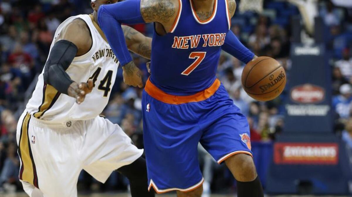 New York Knicks forward Carmelo Anthony (7) drives to the basket past New Orleans Pelicans forward Dante Cunningham (44) in the second half of an NBA basketball game in New Orleans, Monday, March 28, 2016. The Pelicans won 99-91.