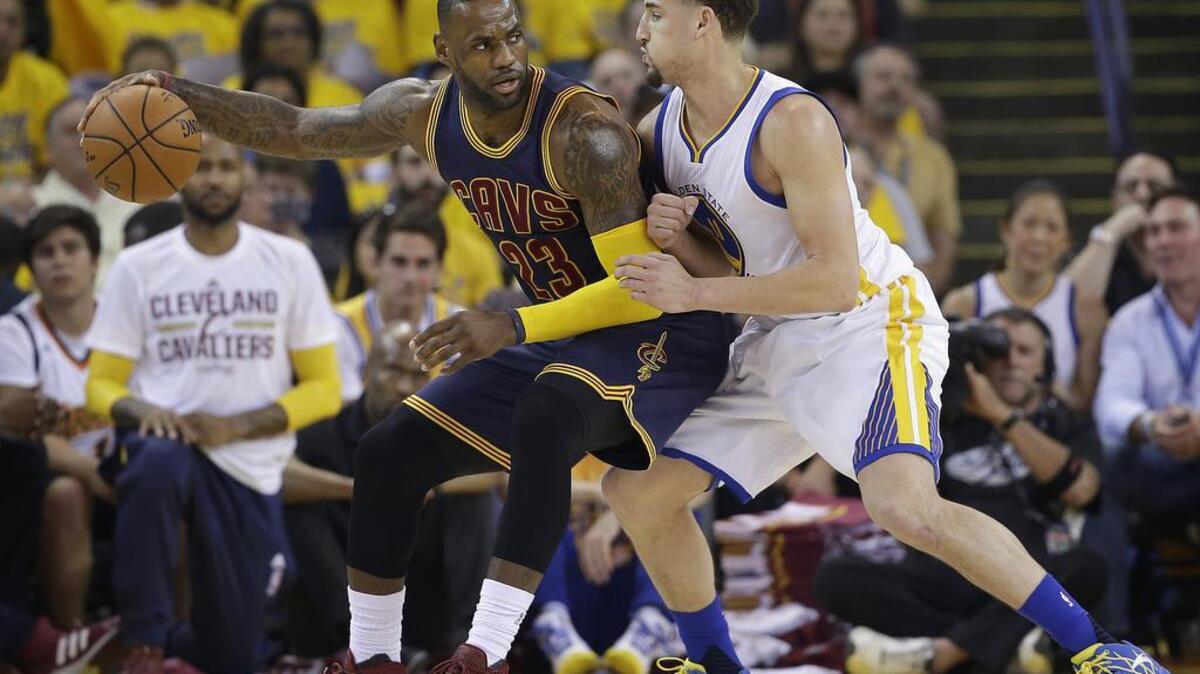 Cleveland’s LeBron James works against Golden State’s Klay Thompson during Game 1 of the NBA Finals in Oakland on Thursday, June 2, 2016.