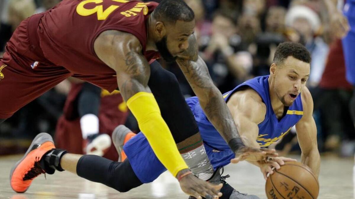 Cleveland Cavaliers forward LeBron James, left, and Golden State Warriors guard Stephen Curry could have their teams on a collision course to meet in the NBA Finals for the third consecutive year.
