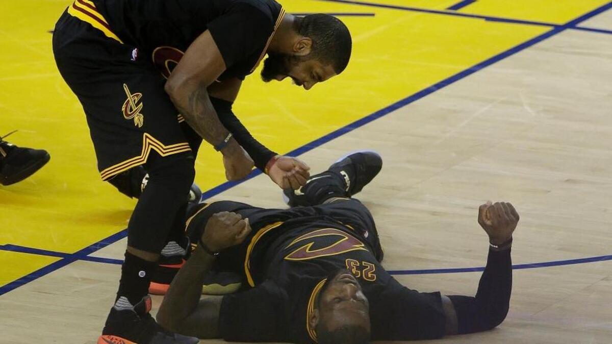 Cleveland Cavaliers center Tristan Thompson, top, celebrates with forward LeBron James during the second half of Game 5 of basketball’s NBA Finals against the Golden State Warriors, Monday, June 13, 2016 in Oakland. The Cavaliers won 112-97 as James and teammate Kyrie Irving each scored 41 points.