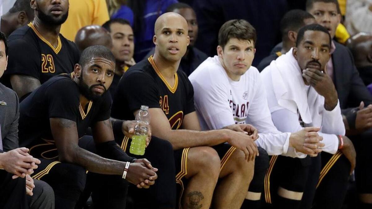 Cleveland Cavaliers players watch from the bench late in Game 2 of the NBA Finals on Sunday in Oakland. The Golden State Warriors won to take a 2-0 series lead. Can the Cavaliers rally from the deficit, like they did last season?
