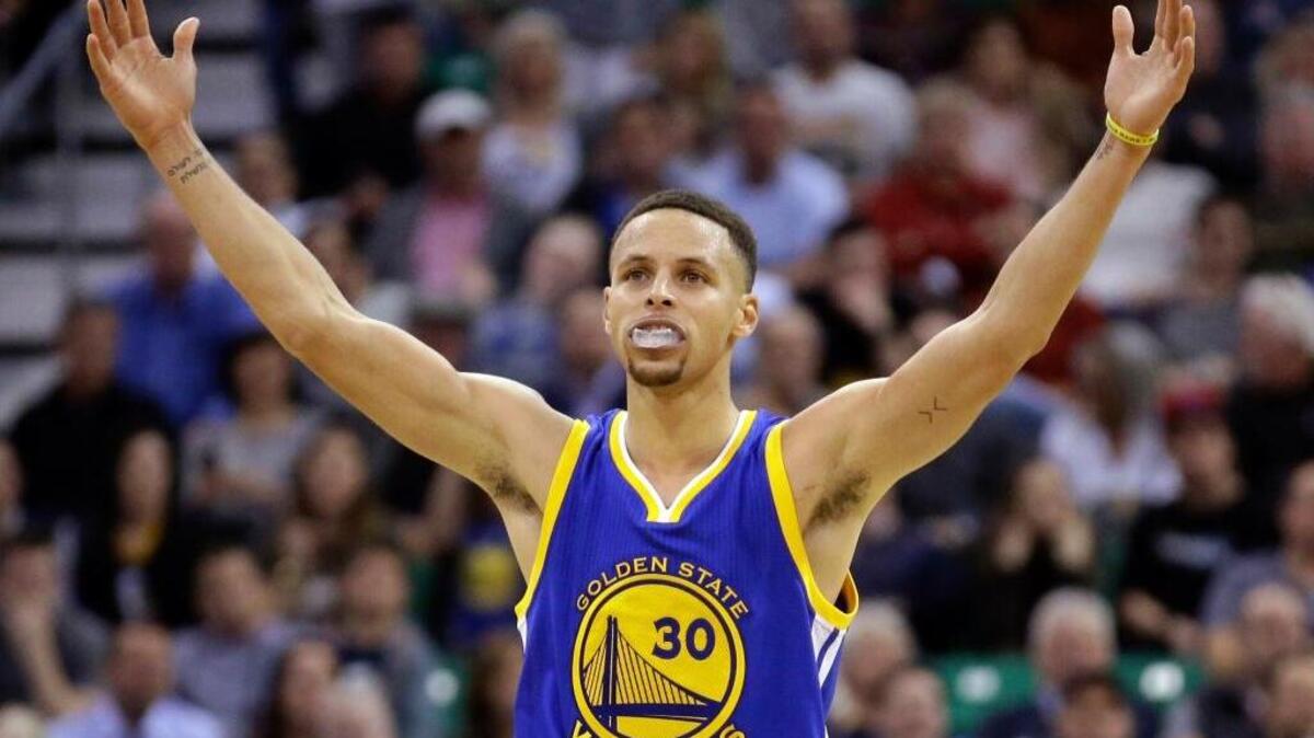 FILE - In this March 30, 2016, file photo, Golden State Warriors guard Stephen Curry celebrates during overtime in an NBA basketball game against the Utah Jazz in Salt Lake City.