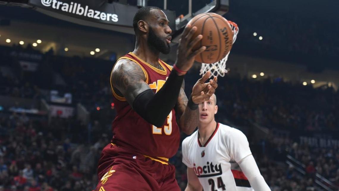 Cleveland Cavaliers forward LeBron James passes the ball as Portland Trail Blazers center Mason Plumlee defends during the first half of an NBA basketball game in Portland, Ore., Wednesday, Jan. 11, 2017.