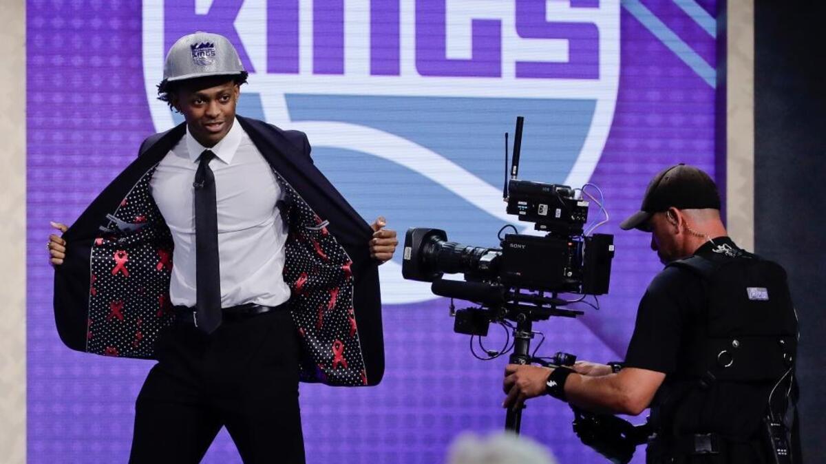 Kentucky’s De’Aaron Fox reacts after being selected by the Kings as the fifth pick during the NBA draft Thursday in New York.