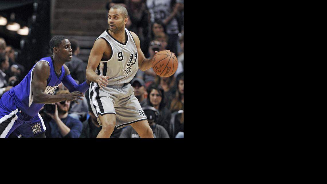
Spurs guard Tony Parker drives to the basket against the Kings’ Darren Collison in the first half.

