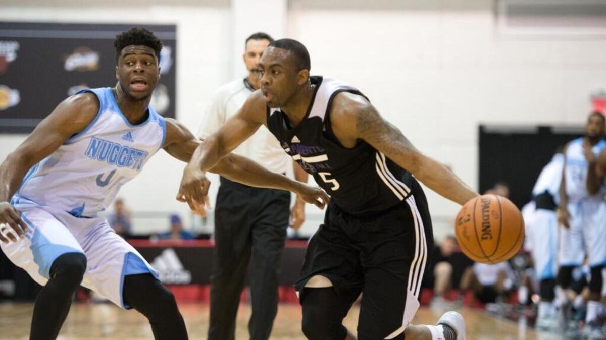 The Kings’ James Anderson drives to the basket against Emmanuel Mudiay of the Denver Nuggets on July 12 at the Cox Pavilion in Las Vegas.
