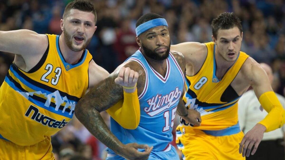 The Kings’ DeMarcus Cousins battles for position with Nuggets center Jusuf Nurkic, left, and forward Danilo Gallinari in first quarter Friday, Feb. 19, 2016 at Sleep Train Arena in Sacramento.