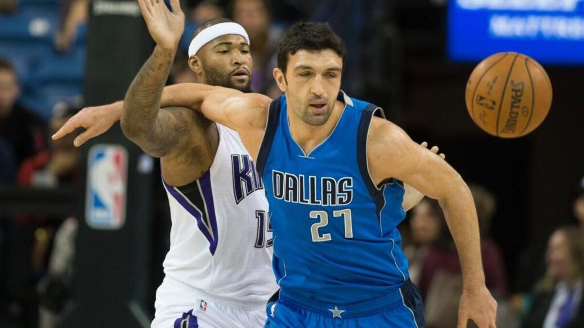 Kings forward DeMarcus Cousins (15) attempts to steal the ball from Dallas Mavericks center Zaza Pachulia (27) during an NBA basketball game on Monday, Nov. 30, 2015 at Sleep Train Arena in Sacramento.