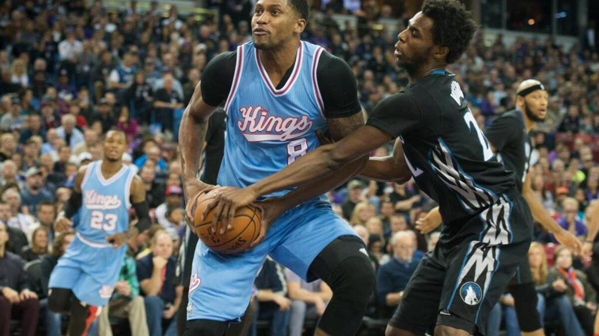 Kings forward Rudy Gay loses the ball as he is guarded by Minnesota’s Andrew Wiggins at Sleep Train Arena in Sacramento on Friday, Nov. 27, 2015.