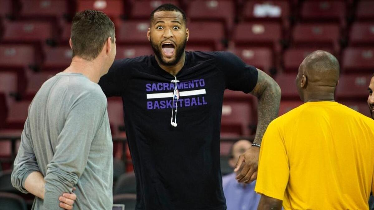 Sacramento Kings center DeMarcus Cousins (15) has reason to be happy. He has as many games of 35 points and 20 rebounds (four) in the past five seasons as the rest of the NBA combined. ... Cousins chats with Denver Nuggets assistants coaches before their NBA basketball game on Friday, Feb. 19, 2016 at Sleep Train Arena in Sacramento.