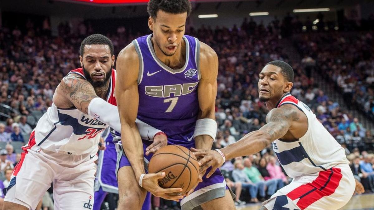 Kings forward Skal Labissiere (7) fights for control of the ball against the Washington Wizards at the Golden 1 Center in Sacramento on Sunday.