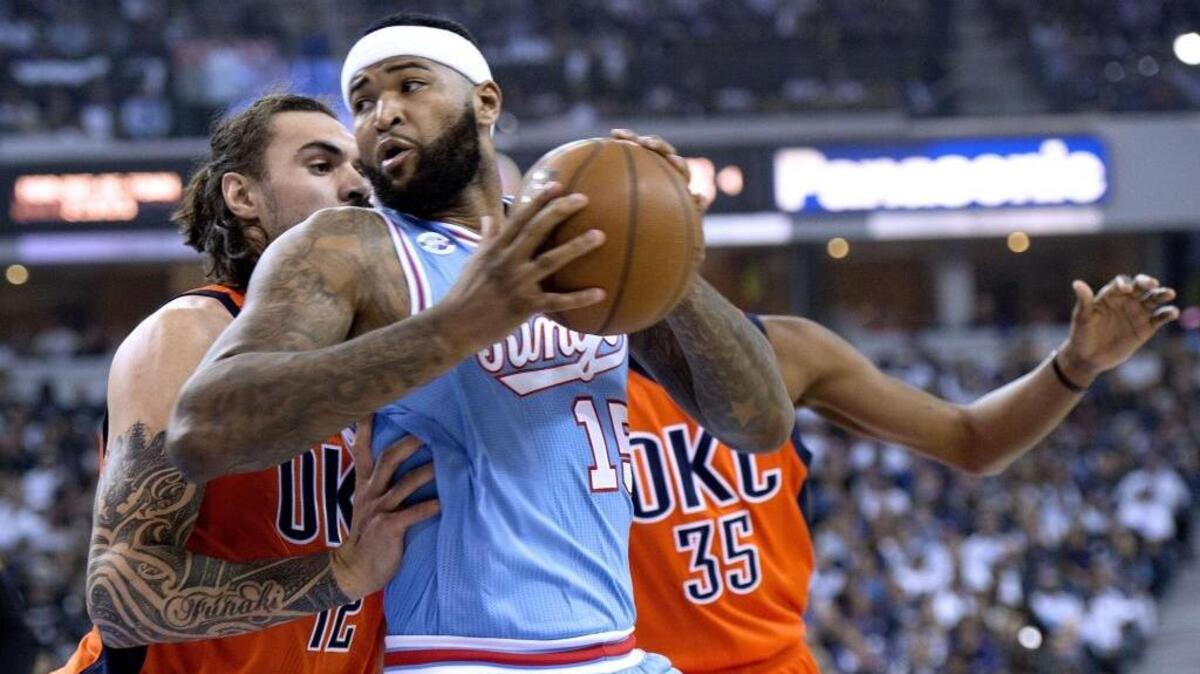 Kings center DeMarcus Cousins (15) backs in against Oklahoma City Thunder center Steven Adams during the Kings’ last game at Sleep Train Arena on April 9, 2016.