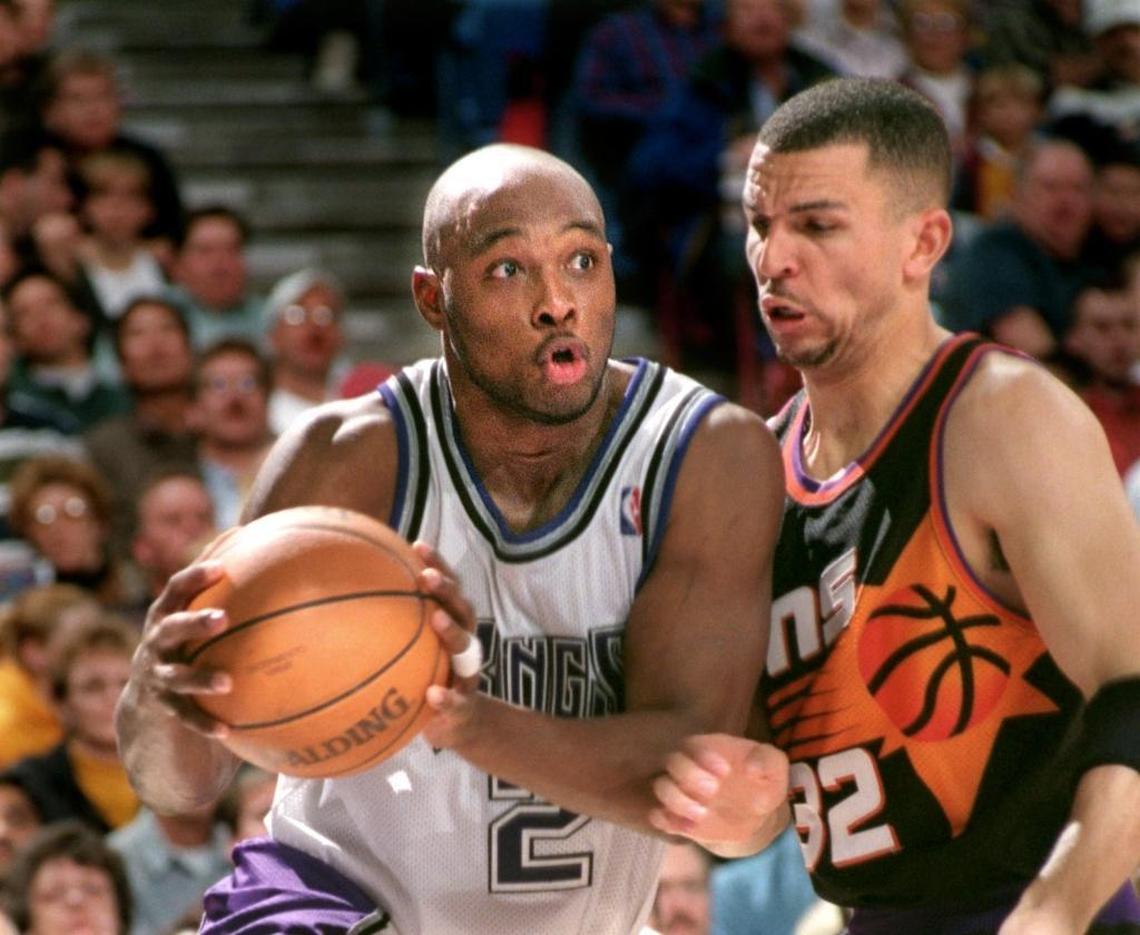 Kings guard Mitch Richmond drives for a basket while being guarded by Phoenix Suns guard Jason Kidd on Jan. 12, 1998 at Arco Arena.