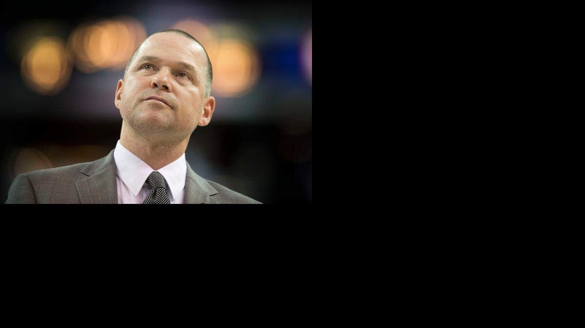 
Sacramento Kings head coach Michael Malone walks on the court during a time out as he attempts to take control of the game against the Memphis Grizzlies on Sunday, Nov. 30, 2014 at Sleep Train Arena in Sacramento.
