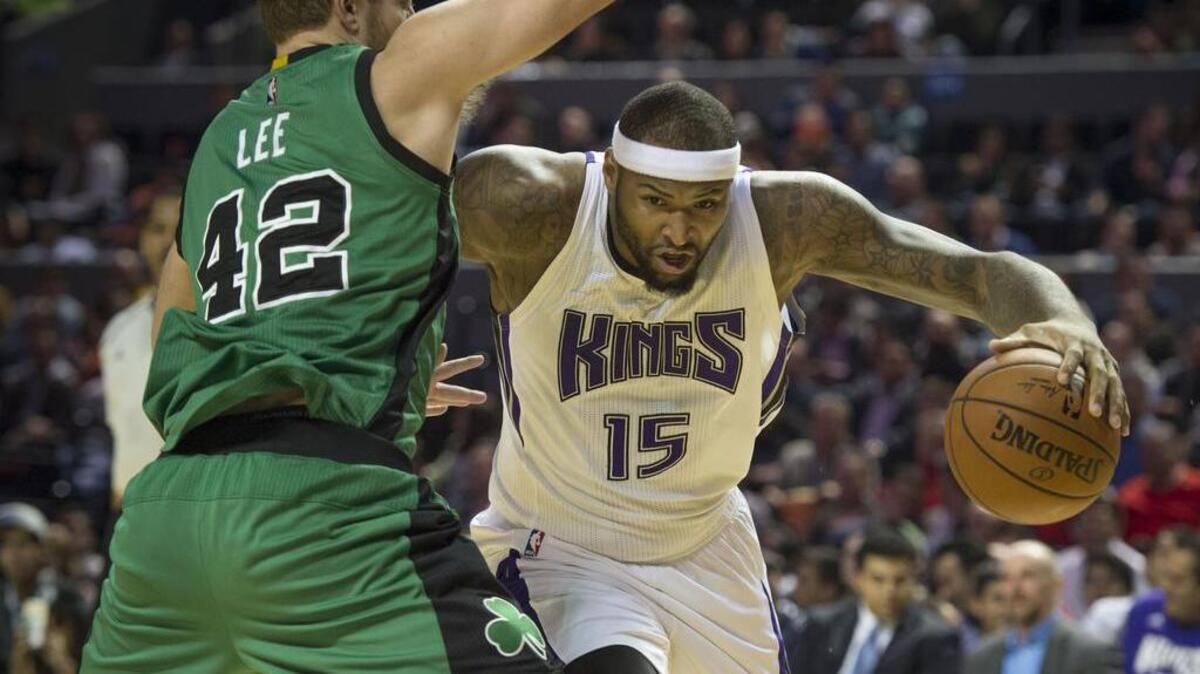 Kings forward DeMarcus Cousins (15) goes to the basket against Boston Celtics forward David Lee (42) on Thursday, Dec. 3, 2015 at Mexico City Arena in Mexico City.