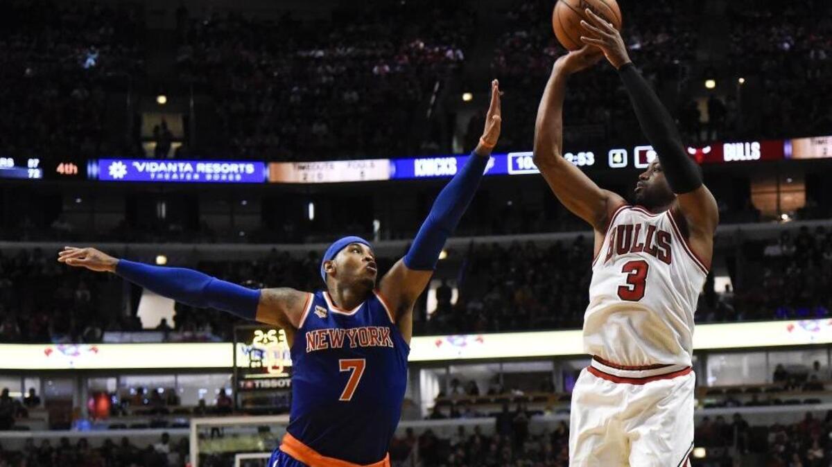 Chicago Bulls guard Dwyane Wade shoots over New York Knicks forward Carmelo Anthony on Nov. 4, 2016, in Chicago. They are two of the most discussed people in ESPN’s #NBArank, a listing of its top 100 players.