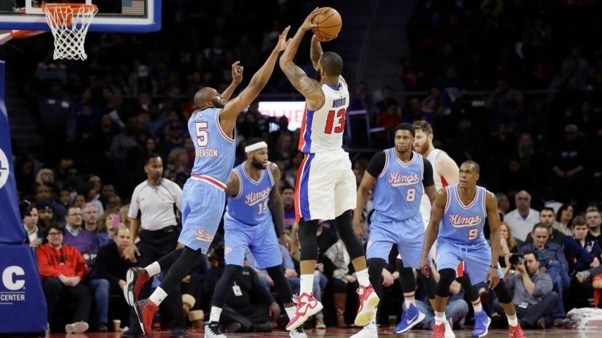 Detroit Pistons forward Marcus Morris shoots a three-pointer over Kings guard James Anderson during the second half Friday, March 18, 2016, in Auburn Hills, Mich.