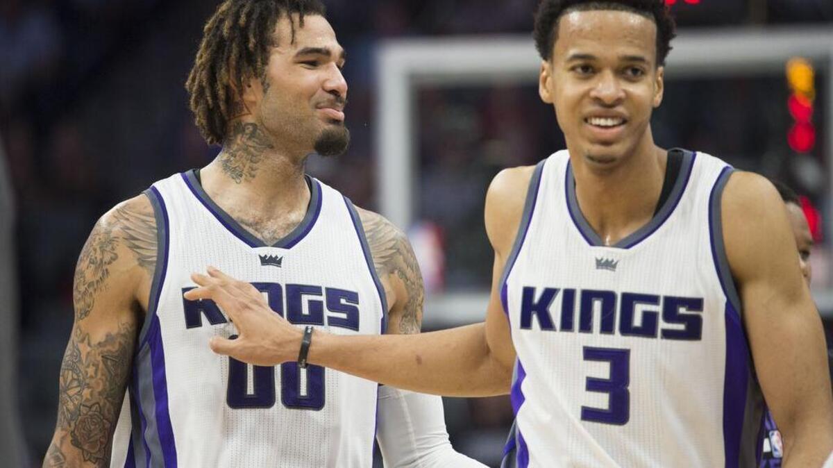 Sacramento Kings center Willie Cauley-Stein (00) and teammate Sacramento Kings forward Skal Labissiere (3) walk to the bench as they celebrate their lede against the Orlando Magic during their game at Golden 1 Center in Sacramento on Monday, March 13, 2017.