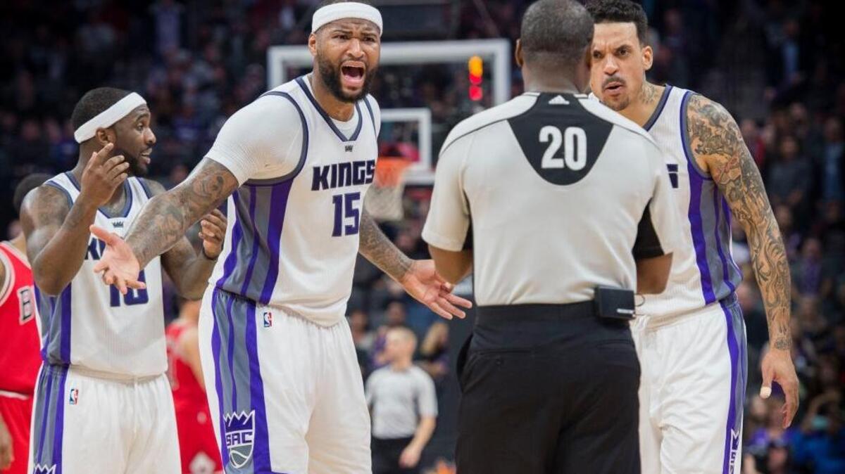 Sacramento Kings forward DeMarcus Cousins (15) and teammate Matt Barnes complian to referee Leroy Richardson about a technical foul call in a game against the Chicago Bulls at Golden 1 Center in Sacramento, California on Monday, February 6, 2017.