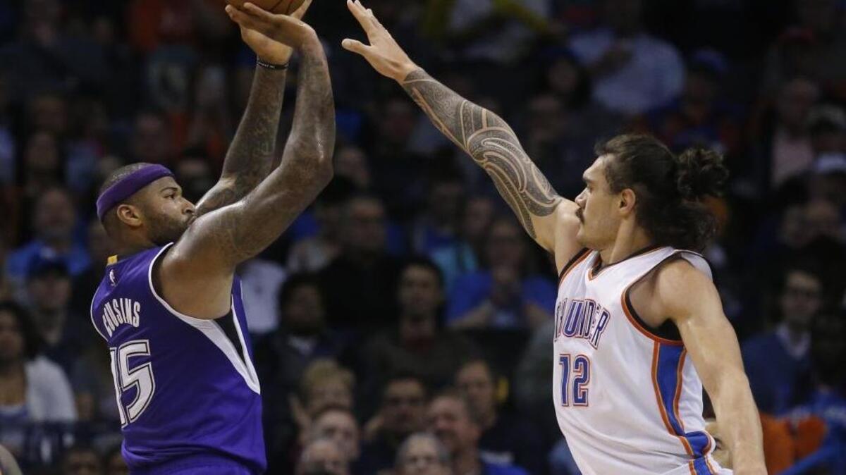 Sacramento Kings forward DeMarcus Cousins (15) shoots as Oklahoma City Thunder center Steven Adams (12) defends during an NBA basketball game in Oklahoma City, Monday, Jan. 4, 2016. Sacramento won 116-104 for its first win ever in Oklahoma City.