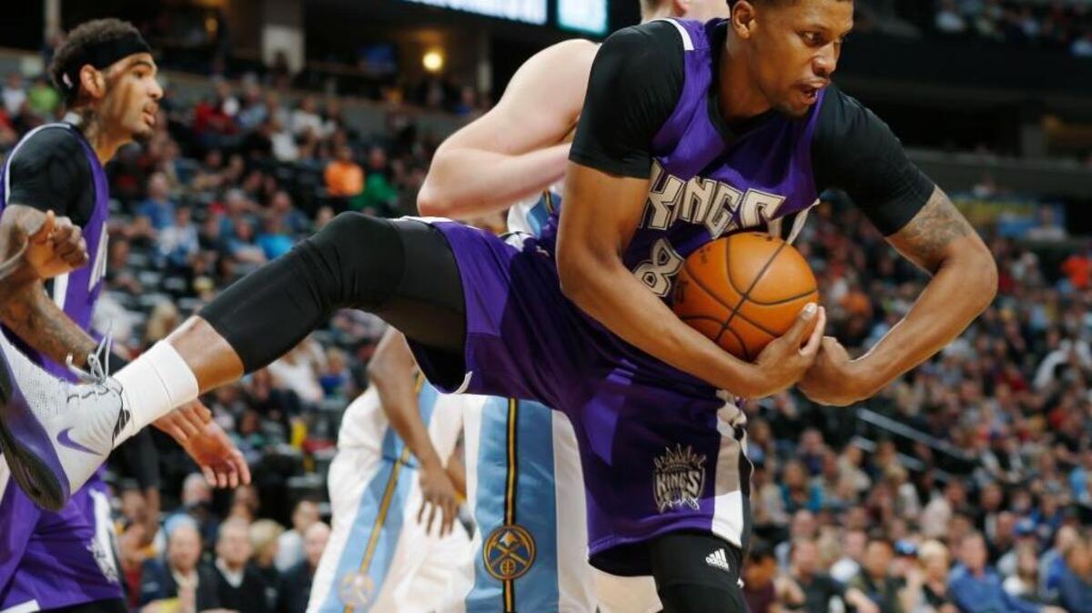 Rudy Gay of the Kings grabs a rebound in Saturday’s win over the Nuggets in Denver.