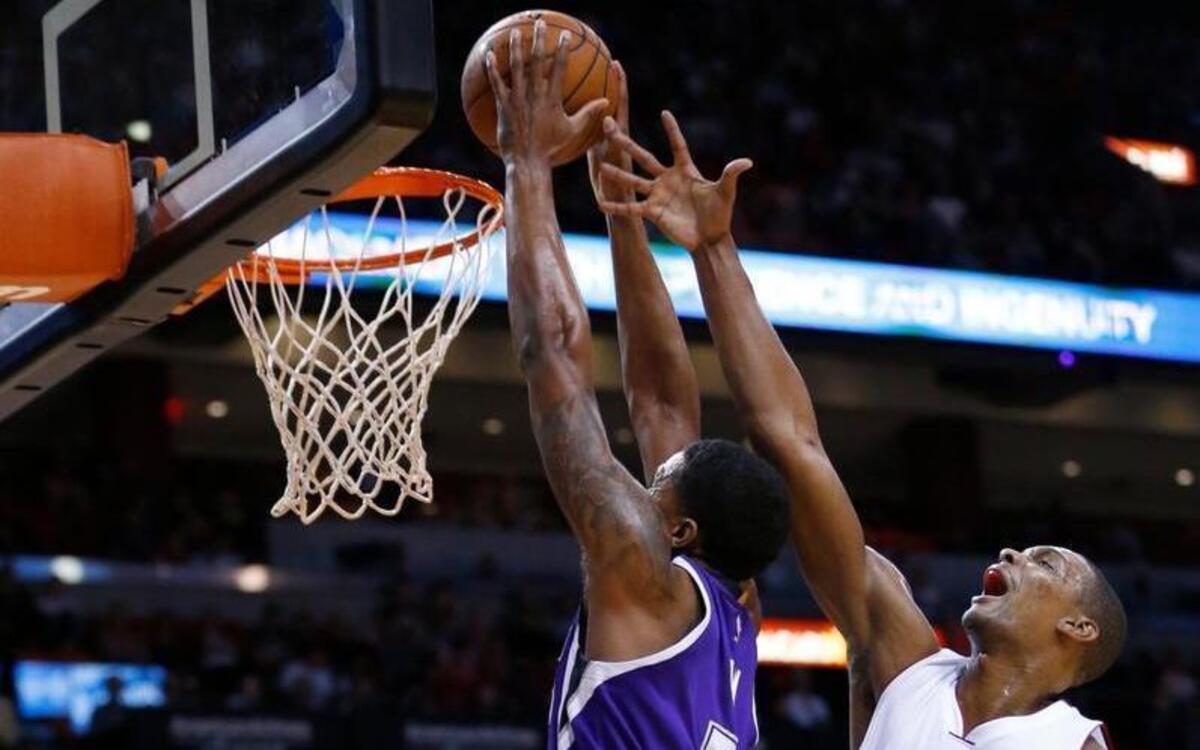 Kings forward Rudy Gay goes for a dunk against Miami Heat forward Chris Bosh (1) on Thursday, Nov. 19, 2015, in Miami. The Heat defeated the Kings 116-109.
