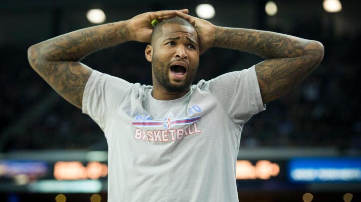 DeMarcus Cousins reacts to a dunk by teammate forward Omri Casspi against the Minnesota Timberwolves at Sleep Train Arena in Sacramento on Friday, Nov. 27, 2015.