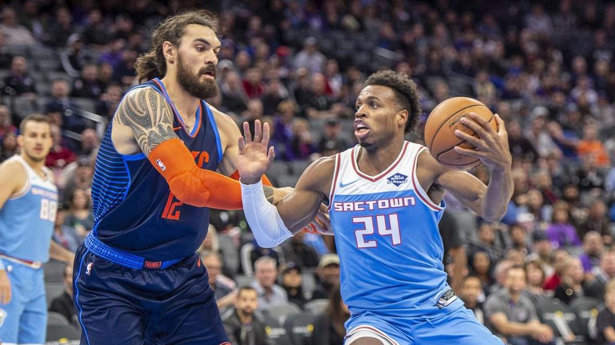 Sacramento Kings guard Buddy Hield (24) drives to etc basket against the Oklahoma City Thunder center Steven Adams (12) on Wednesday, Dec.19, 2018 at the Golden 1 Center in Sacramento, California.